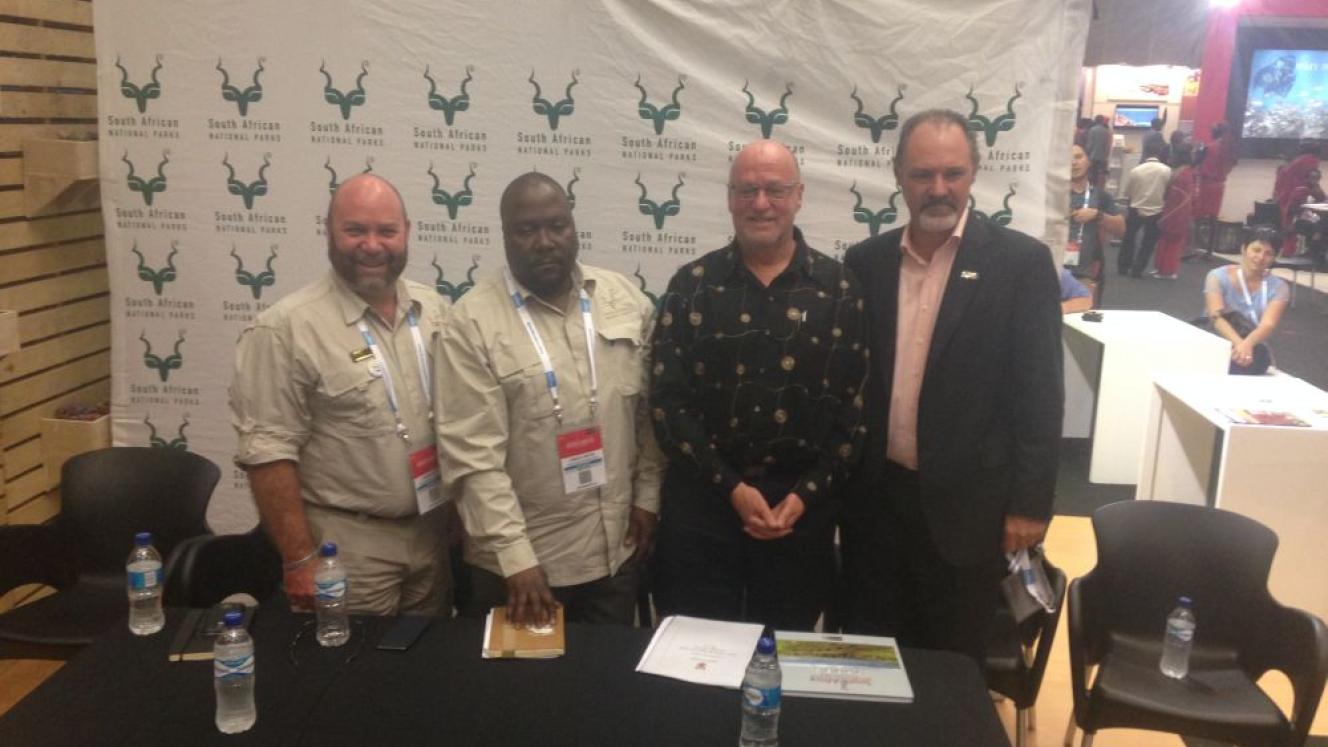 From left: SANParks Managing Executive, Tourism Development and Marketing, Glenn Phillips; CEO of SANParks, Fundisile Mketeni; Minister of Tourism, Derek Hanekom; and SATSA CEO, David Frost.