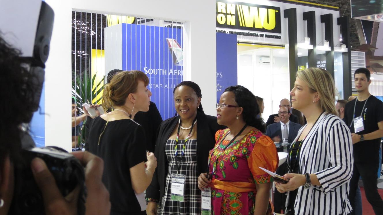 Deputy Minister of Tourism, Thokozile Xasa, engages with exhibitors at the ABAV tradeshow in São Paulo. The Deputy Minister is pictured with Velma Corcoran, Executive Marketing Manager at Cape Town Tourism, and South African Consul General to Brazil, Mmaikeletsi Dube (left), and Monika Iuel, South African Tourism General Manager: International Marketing (right).