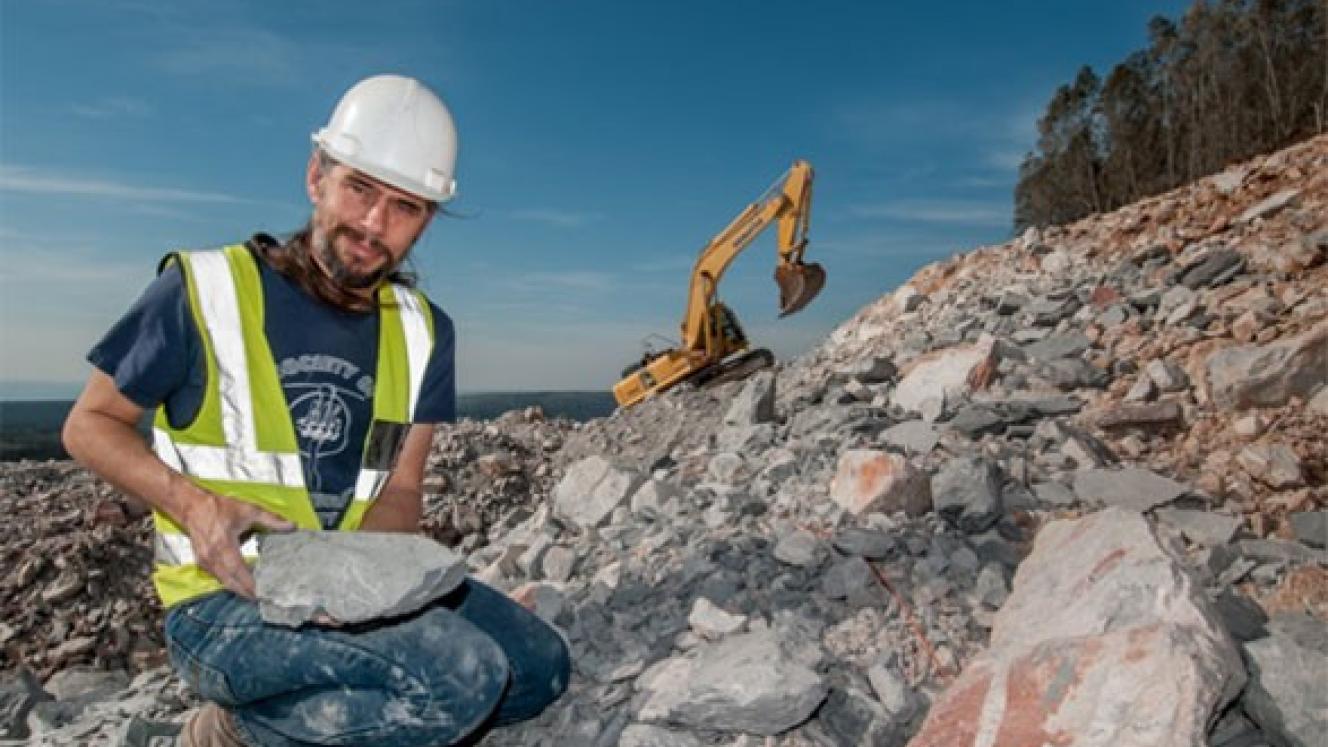 Dr. Robert Gess with 360-million-year-old invertebrate and plant fossils discovered outside Grahamstown, Eastern Cape.