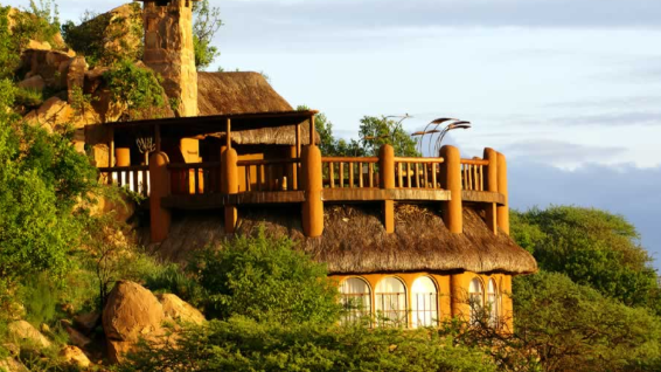 The library at Sanctuary at Ol Lentille viewing deck has an open fire, a bar and a GPS-controlled telescope.