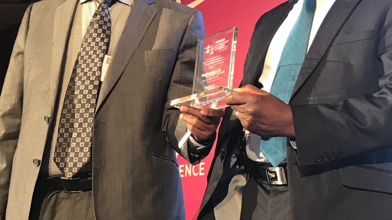 Former Ethiopian Airlines CEO and former RwandAir chairman, Girma Wake, presents IATA VP for Africa, Raphael Kuuchi, with a life-time achievement award at the AviaDev conference in Cape Town.