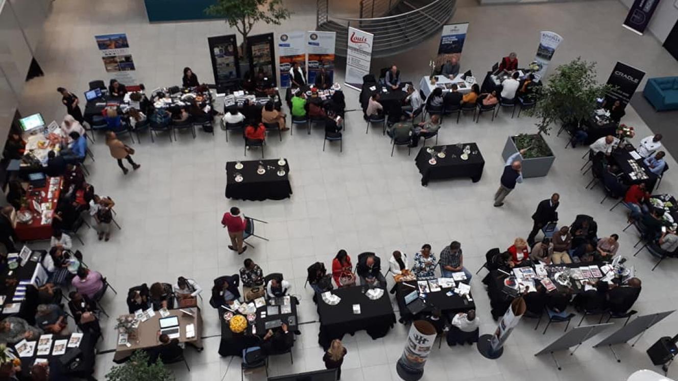 Exhibitors explain their products and services to potential buyers.