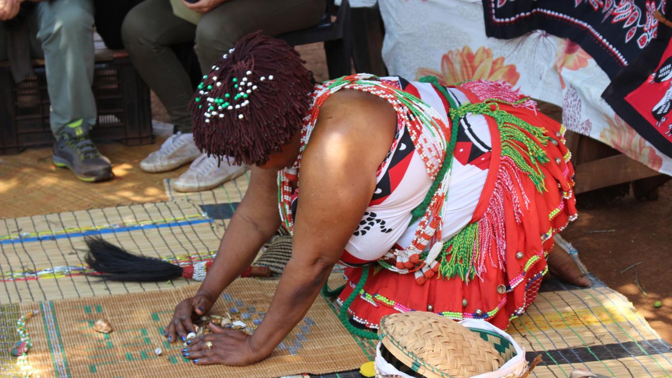 Village sangoma throwing the bones for visitors.