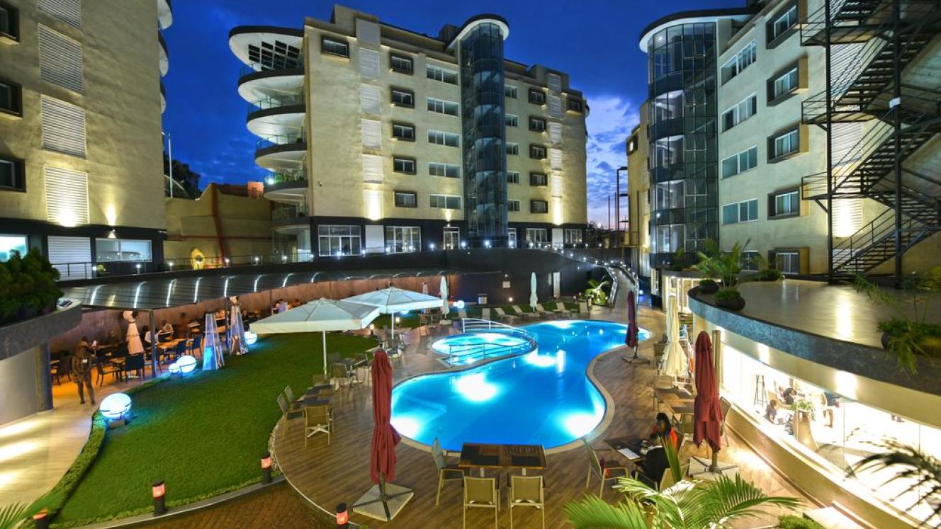 Features include a Presidential Suite and a variety of restaurants and bars, with a unique rooftop cocktail bar.