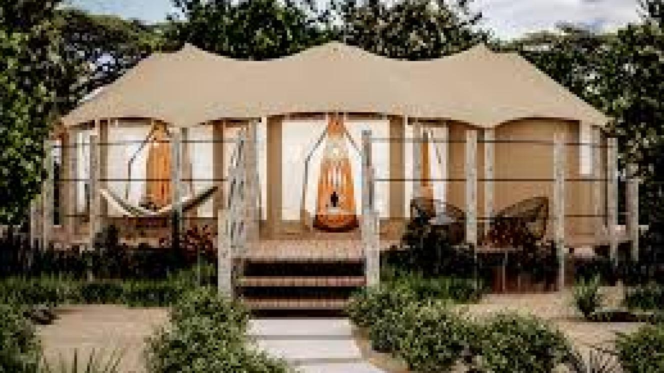 Each tent has a private balcony overlooking the Talek river.