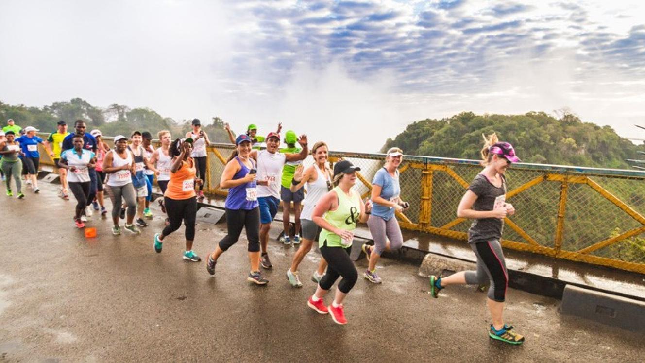 Runners crossing the Victoria Falls Bridge.
