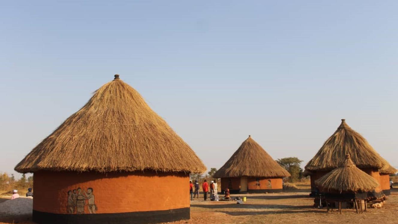 Part of the cultural village showing traditionally decorated huts.