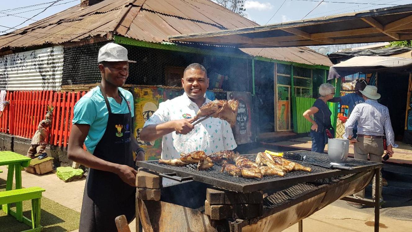 Delone Jacobs (right) includes authentic food and cultural experiences on his tours.