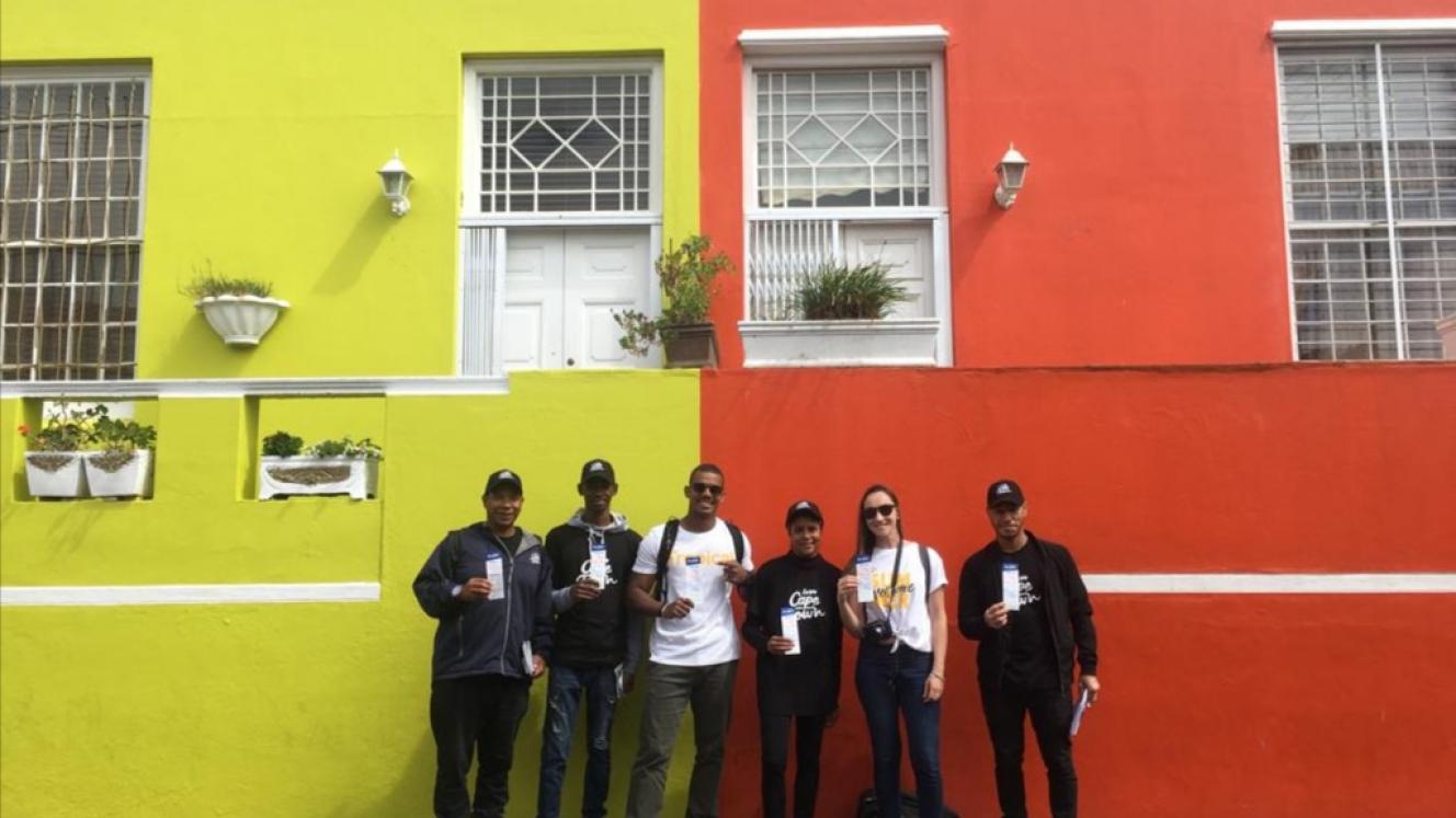 Tourists posing with Travel Wise ambassadors in their ‘Love Cape Town’ branded shirts.