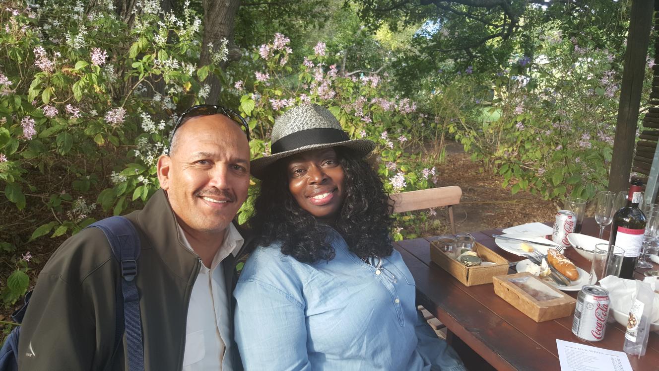 Managing Director of Wow Travel & Tours, Rushdi Harper, is pictured with US musical artist, Angie Stone.