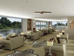 The Zambezi Queen houseboat sailing down the Chobe River.