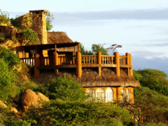 The library at Sanctuary at Ol Lentille viewing deck has an open fire, a bar and a GPS-controlled telescope.