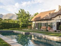 The property is on a working wine farm and is a five-minute walk from village restaurants and shops.