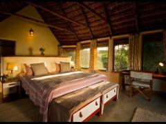 The cottages are nestled on the river bank, along from the main lodge.