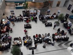 Exhibitors explain their products and services to potential buyers.