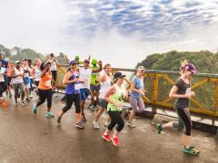 Runners crossing the Victoria Falls Bridge.