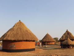 Part of the cultural village showing traditionally decorated huts.
