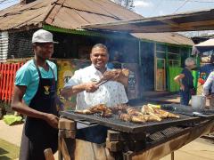 Delone Jacobs (right) includes authentic food and cultural experiences on his tours.