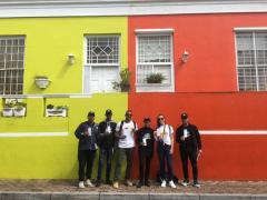 Tourists posing with Travel Wise ambassadors in their ‘Love Cape Town’ branded shirts.